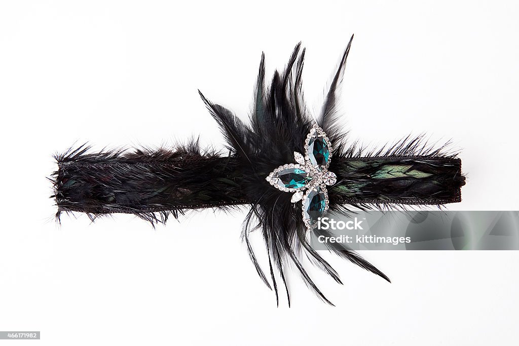 Black feather headband with jewelry Black feather headband on white Feather Stock Photo