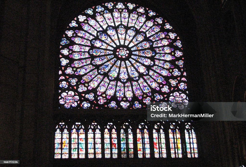 The Notre Dame Cathedral: stained glass Aa beautiful stained-glass window is seen on the interior of the Notre Dame Cathedral. 2015 Stock Photo