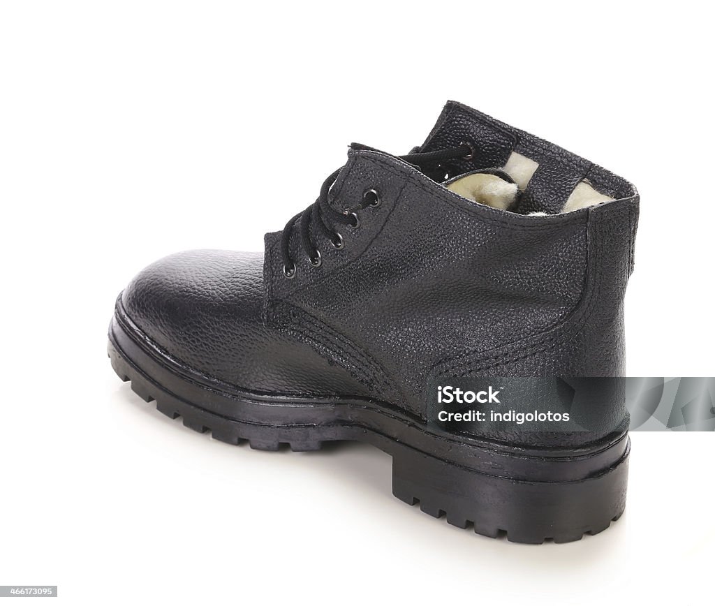 Close up of winter black boot. Close up of winter black boot. Isolated on a white background. Activity Stock Photo