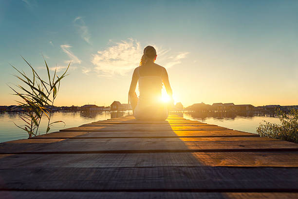 istock Young woman enjoying the sunset 466176391