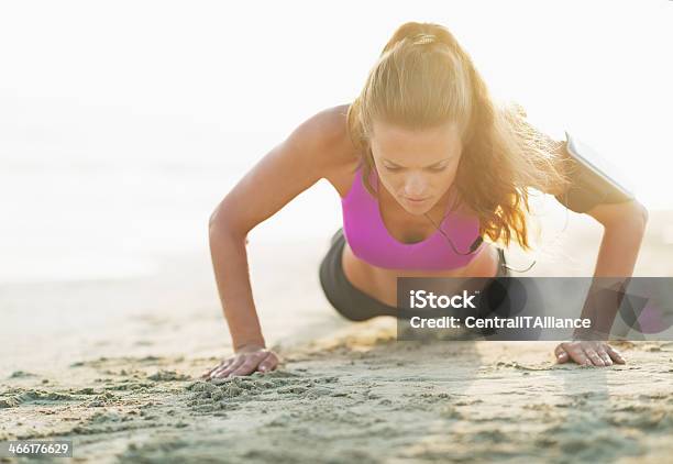 Fitness Young Woman Doing Push Ups On Beach Stock Photo - Download Image Now - Active Lifestyle, Adult, Anaerobic Exercise