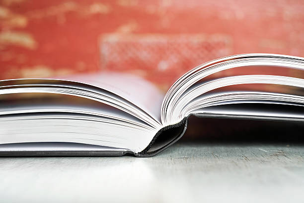 istock Close-up of an open book on table 466177842