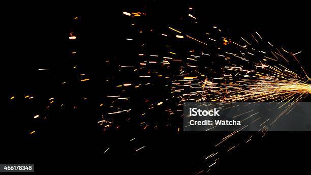 Glowing Flow Of Sparks In The Dark Stock Photo - Download Image Now - Sparks, Black Background, 2015