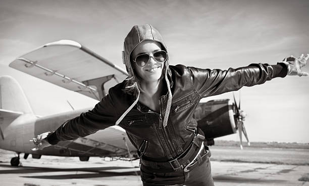 istock Young beautiful woman pilot on a airplane. 466178593
