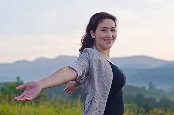 istock Pretty woman with opened arms expressing freedom 466179249