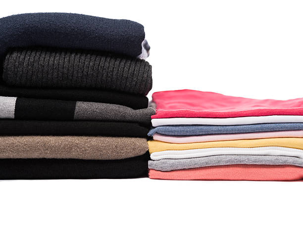 istock Stacks of winter pullovers and summer t-shirts 466182468