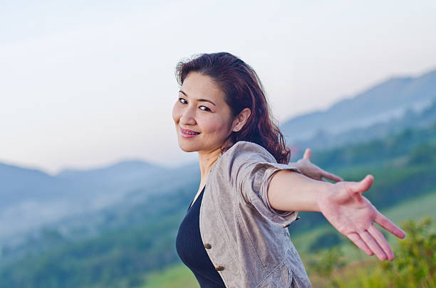 istock Pretty woman with opened arms expressing freedom 466182585