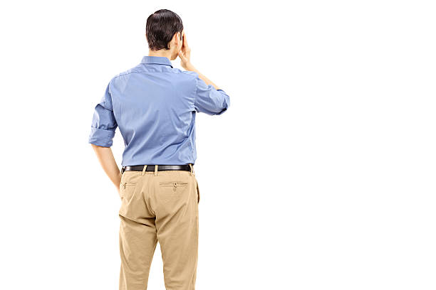 istock Man holding hand against his eye, rear view 466183979