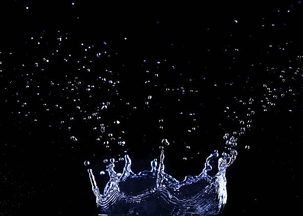 istock brilliant drops transparent water on black background 466186368