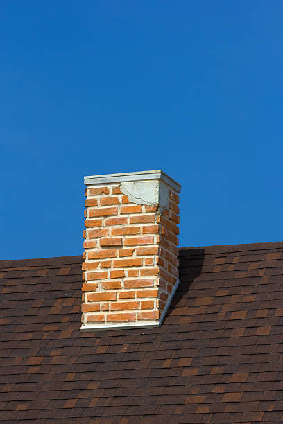 istock The brick chimney in bright sunlight a deep blue sky 466186605