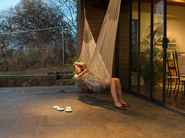 Woman relaxing in Hammock