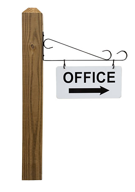 Office Sign on Wooden Post
