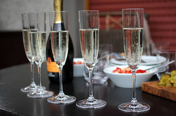 istock Champagne with snacks and food 466188695