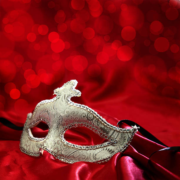 istock Vintage venetian carnival mask on red background 466189499