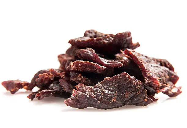 Heap of Beef Jerky on white background