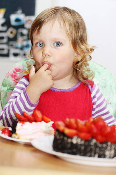 istock girl licks a finger 466195807
