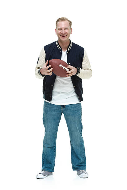 istock Cheerful college student holding football 466196126
