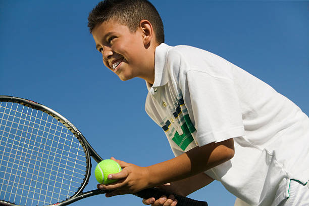 istock Young Tennis Player Preparing to Serve 466196759