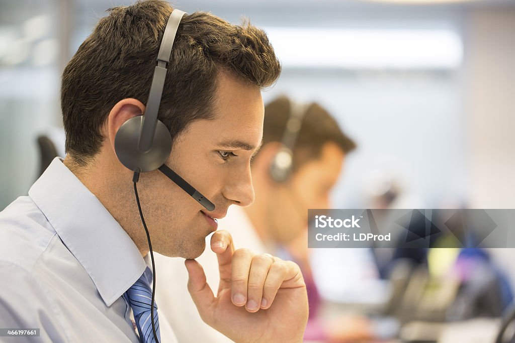 Call center team at office on the phone with headset Male  business talk micro operator Home Video Camera Stock Photo