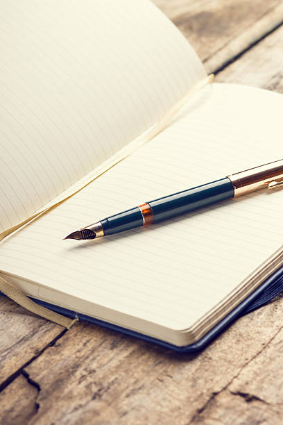 istock Opened blank notebook with elegant fountain pen 466198050