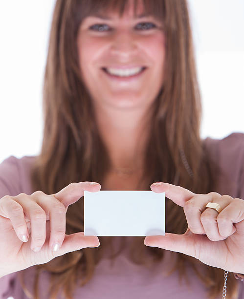 istock Woman showing a business card 466198265