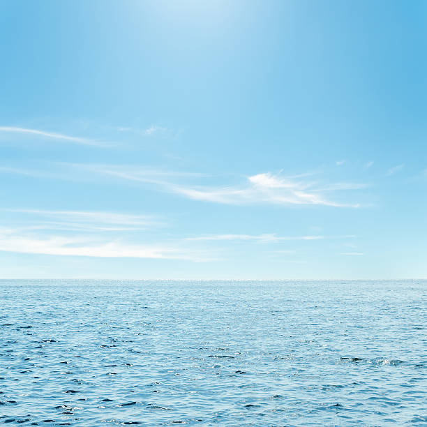 istock blue sea and clouds in sky over it 466198617