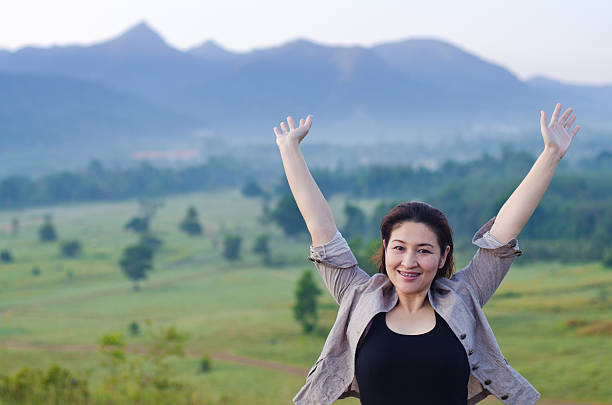 istock Pretty woman with opened arms expressing freedom 466199467