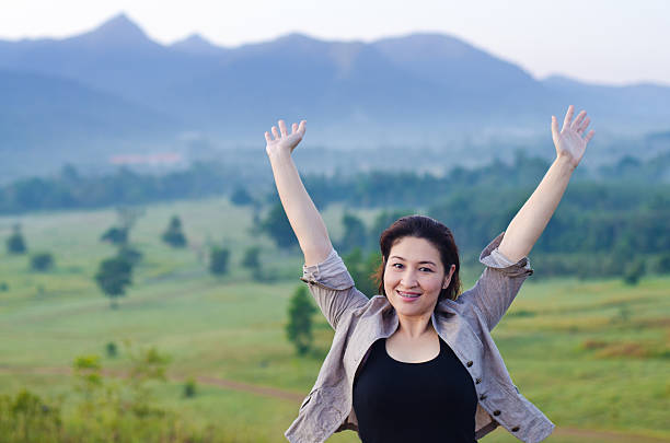 istock Pretty woman with opened arms expressing freedom 466199627