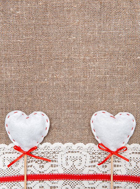 istock Textile hearts and lacy cloth on the burlap 466200055