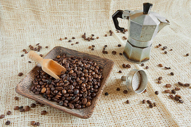 istock coffee roasted beans next to an Italian moka 466200452