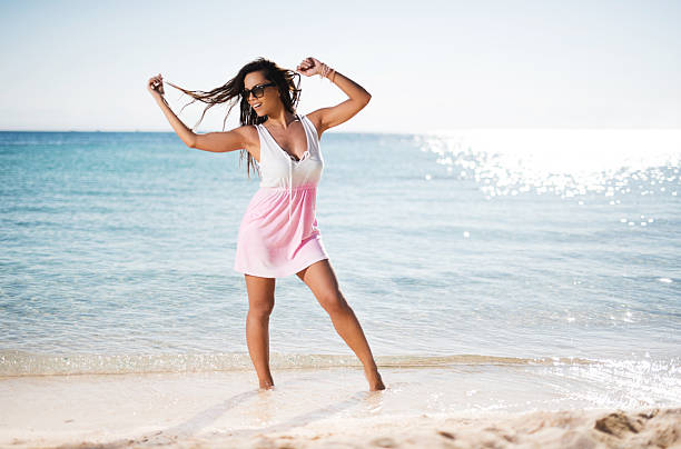 istock Beautiful young woman having fun on the beach. 466201524