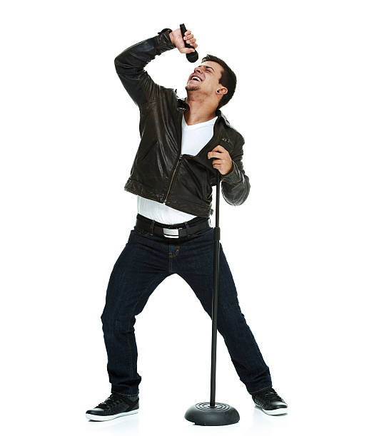 istock Smiling casual man singing song with microphone 466201542