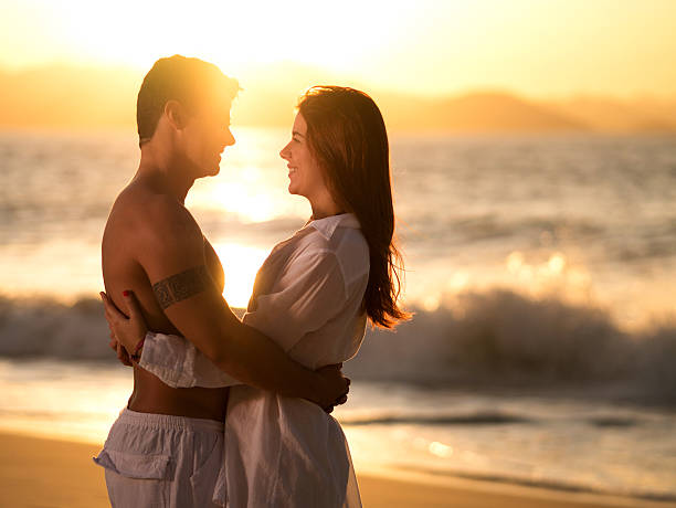 istock Romantic couple enjoying on the beach at sunset. 466201734