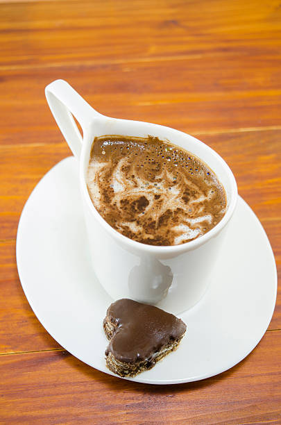 istock Cup of coffee and a heart shaped chocolate 466202068