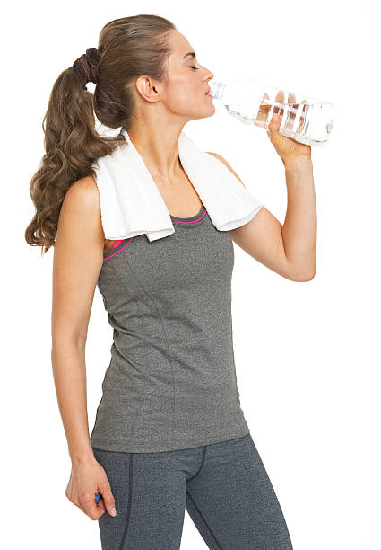 istock healthy young woman drinking water 466202825