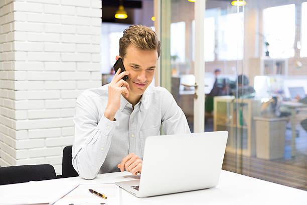 istock A businessman taking a call on a mobile phone in the office 466204355