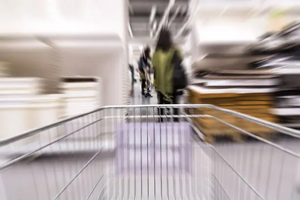 Motion blurred  shopping cart in home furniture store