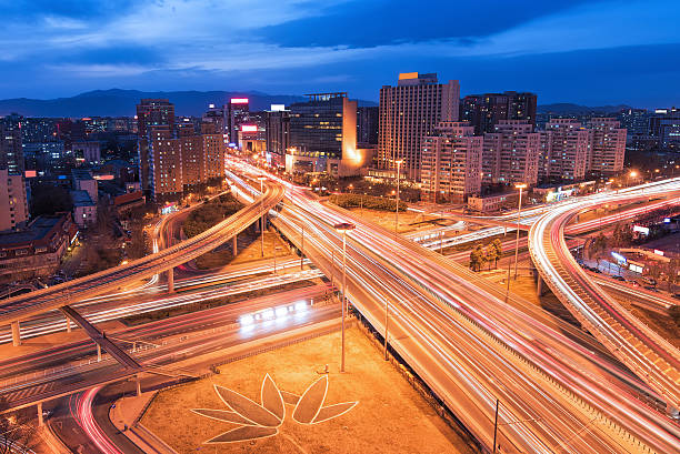 istock The light trails on the modern building background in Beijing china. 466207368