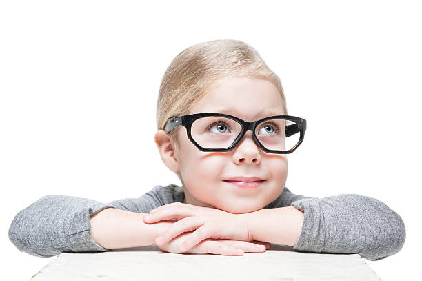 istock Smart beautiful little girl in glasses looking on something 466208818