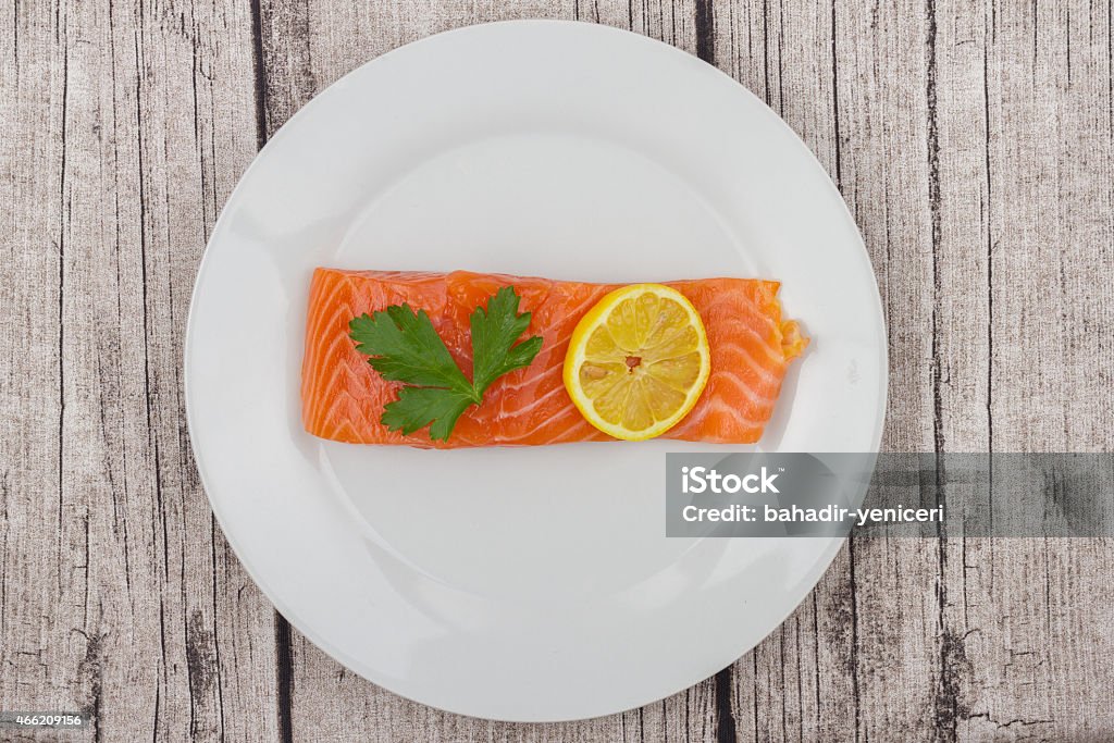 Salmon Fillet A Raw Salmon Fillet on a Rustic Table 2015 Stock Photo
