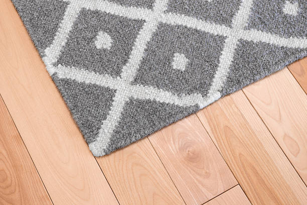 istock Gray rug on wooden floor 466209653