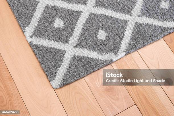 Gray Rug On Wooden Floor Stock Photo - Download Image Now - Rug, Carpet - Decor, Hardwood