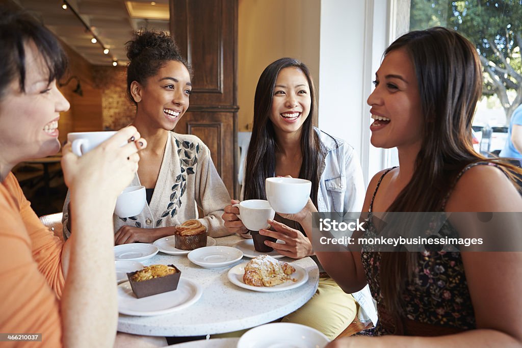 Group Of Female Friends Meeting In Café Restaurant Group Of Happy Smiling Female Friends Meeting In Café Restaurant Women Stock Photo