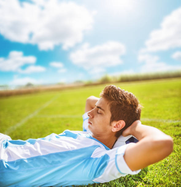 istock Soccer player resting on the field 466211341