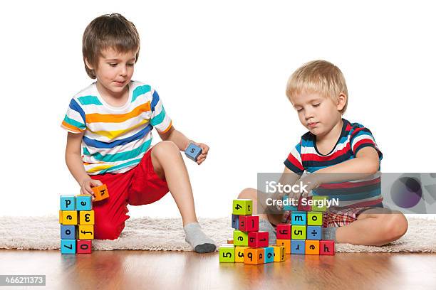 Two Clever Boys With Blocks Stock Photo - Download Image Now - Activity, Alphabet, Boys