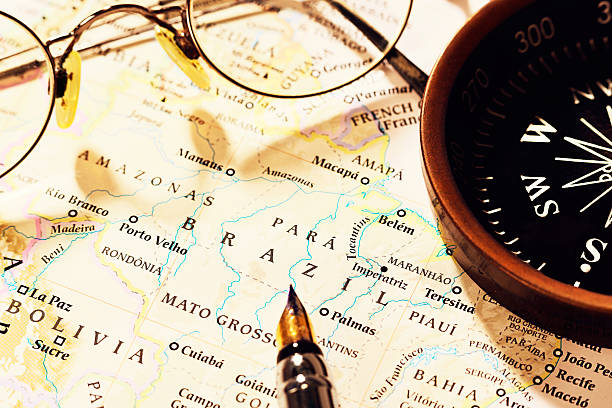 istock South American travel plans with compass, pen, and spectacles 466211743