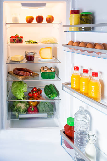 istock Open fridge filled with food 466211784