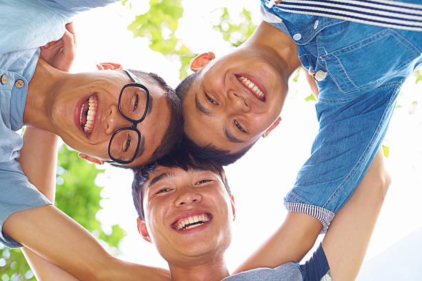 istock three happy young friends together 466211985