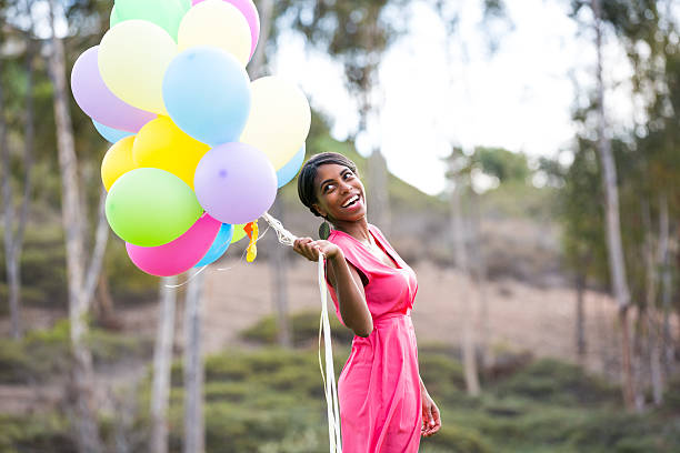 istock Girl with colorful balloons 466212135