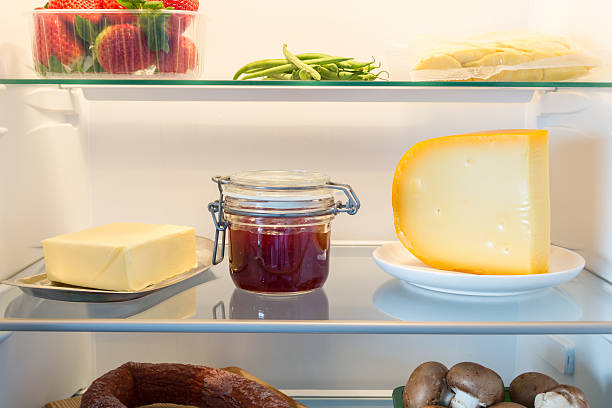 Open fridge filled with food stock photo